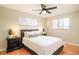 Bedroom featuring hardwood floors, ceiling fan, two windows and night stands at 505 Everett St, Lakewood, CO 80226