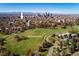 Aerial view showcasing Cheesman Park, downtown Denver, and the mountain range in the distance at 1050 N Clarkson St, Denver, CO 80218
