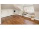 Attic room featuring hardwood flooring, a window seat, and a cozy atmosphere at 1050 N Clarkson St, Denver, CO 80218