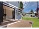 Outdoor deck features wood flooring and a view of the lush, green backyard at 1050 N Clarkson St, Denver, CO 80218