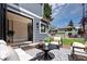 Relaxing backyard patio with modern furniture and outdoor access, perfect for entertaining guests at 1050 N Clarkson St, Denver, CO 80218