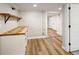 Stylish basement bar area featuring wood countertop, shelving, drawers, and painted brick wall at 1050 N Clarkson St, Denver, CO 80218