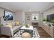 Cozy basement living area featuring a comfortable sofa, modern decor, and stylish furnishings at 1050 N Clarkson St, Denver, CO 80218
