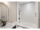 Updated bathroom with a white subway tile shower, bathtub, and modern sink vanity at 1050 N Clarkson St, Denver, CO 80218