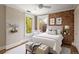 Charming bedroom with exposed brick wall and windows, creating a unique and inviting space at 1050 N Clarkson St, Denver, CO 80218