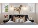 A comfy primary bedroom with large bed, stylish decor, and ample natural light at 1050 N Clarkson St, Denver, CO 80218