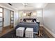 Stylish bedroom with barn door, ample natural light, and sophisticated decor at 1050 N Clarkson St, Denver, CO 80218