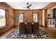 Dining room with exposed brick wall, hardwood floors, and contemporary rug at 1050 N Clarkson St, Denver, CO 80218