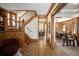 Open foyer with beautiful hardwood floors, staircase, and views into the dining and living areas at 1050 N Clarkson St, Denver, CO 80218