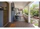 Inviting front porch with seating area, stylish striped rug, and charming exterior details at 1050 N Clarkson St, Denver, CO 80218
