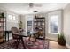 Stylish home office featuring modern decor, providing an ideal workspace with a decorative rug at 1050 N Clarkson St, Denver, CO 80218