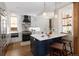 Contemporary kitchen with island, stainless steel appliances, and pendant lighting at 1050 N Clarkson St, Denver, CO 80218