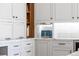 Bright kitchen features marble counters, white cabinets, tile backsplash, and stainless steel appliances at 1050 N Clarkson St, Denver, CO 80218