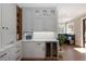 Elegant kitchen with custom cabinets, beverage cooler, and marble countertops at 1050 N Clarkson St, Denver, CO 80218