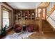 Charming living room with custom built-ins, hardwood floors, and staircase at 1050 N Clarkson St, Denver, CO 80218