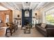 Bright living room boasts fireplace, coffered ceilings, and abundant natural light at 1050 N Clarkson St, Denver, CO 80218