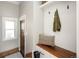 Inviting mudroom boasts stylish tile floors, convenient bench with storage, and coat hooks at 1050 N Clarkson St, Denver, CO 80218