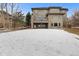 Exterior view of the back of the home with a patio and a spacious backyard at 1039 Buffalo Ridge Way, Castle Pines, CO 80108