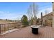 Outdoor deck with a fire pit and views of the surrounding landscape provides a great entertaining space at 1039 Buffalo Ridge Way, Castle Pines, CO 80108