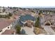 Elegant home featuring a three-car garage, stone accents, and mature landscaping at 1039 Buffalo Ridge Way, Castle Pines, CO 80108