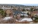 Rear aerial view of a luxurious house with a covered patio and spacious backyard at 1039 Buffalo Ridge Way, Castle Pines, CO 80108