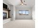 Spacious living room features a fireplace and a large window with scenic views at 1039 Buffalo Ridge Way, Castle Pines, CO 80108