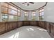 Bright sitting room with custom wood trim details, large windows, and neutral carpet at 1039 Buffalo Ridge Way, Castle Pines, CO 80108