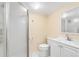 Clean bathroom featuring a glass-enclosed shower, toilet, and vanity at 9376 W Wagon Trail Cir, Littleton, CO 80123