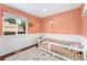 Charming bedroom with a window, chair rail detail, and ample natural light at 9376 W Wagon Trail Cir, Littleton, CO 80123