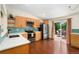 Well-lit kitchen with modern stainless steel appliances and a stylish blue backsplash at 9376 W Wagon Trail Cir, Littleton, CO 80123