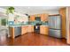 Bright kitchen features modern appliances, sleek countertops, and wooden cabinets at 9376 W Wagon Trail Cir, Littleton, CO 80123
