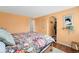Bright main bedroom featuring hardwood floors, closet, and stylish decor at 9376 W Wagon Trail Cir, Littleton, CO 80123
