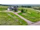 Aerial view of the home on a spacious lot with mature trees at 43793 Buckskin Rd, Parker, CO 80138