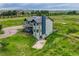 Aerial view of two-story home on a spacious lot with mature trees at 43793 Buckskin Rd, Parker, CO 80138