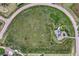 Aerial view of the home on a sprawling lot featuring mature trees and solar panels at 43793 Buckskin Rd, Parker, CO 80138