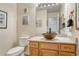 Charming bathroom featuring a unique vessel sink and well-lit mirror, adding a touch of elegance at 43793 Buckskin Rd, Parker, CO 80138