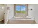 Bathtub with a view of the surrounding green space at 43793 Buckskin Rd, Parker, CO 80138
