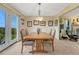 Sunlit dining room with sliding glass doors and views of the surrounding landscape, ideal for entertaining guests at 43793 Buckskin Rd, Parker, CO 80138