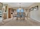 Bright dining room with large windows and a stylish chandelier, perfect for Gathering meals at 43793 Buckskin Rd, Parker, CO 80138