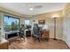 Bright office space with wood floors, a large window, and multiple workstations at 43793 Buckskin Rd, Parker, CO 80138