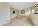 Spacious carpeted room with natural light, a neutral-toned sofa, and decor, creating a relaxing atmosphere at 43793 Buckskin Rd, Parker, CO 80138