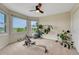 Versatile bonus room with large windows offering scenic views, a ceiling fan, and ample space for activities at 43793 Buckskin Rd, Parker, CO 80138