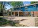 Brick patio, covered pergola, and swing set in backyard at 3824 S Xenia St, Denver, CO 80237