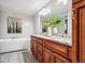 Elegant bathroom with double vanity, granite countertops, and soaking tub at 3824 S Xenia St, Denver, CO 80237