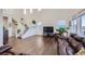 Living room with hardwood floors and brown leather furniture at 5044 Basalt Ridge Cir, Castle Rock, CO 80108