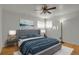 Spacious bedroom featuring a gray platform bed and blue blanket at 14066 E 27Th Ave, Aurora, CO 80011