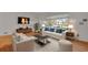 Virtually staged living room with light colored sofa and wood floors at 14066 E 27Th Ave, Aurora, CO 80011