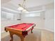 Finished basement featuring a billiards table, neutral walls, and carpet at 15573 E Prentice Ln, Centennial, CO 80015