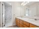 Bright bathroom featuring a shower and vanity with ample counter space at 15573 E Prentice Ln, Centennial, CO 80015
