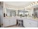 Bright bathroom featuring double sinks, vanities, and ample counter space at 15573 E Prentice Ln, Centennial, CO 80015